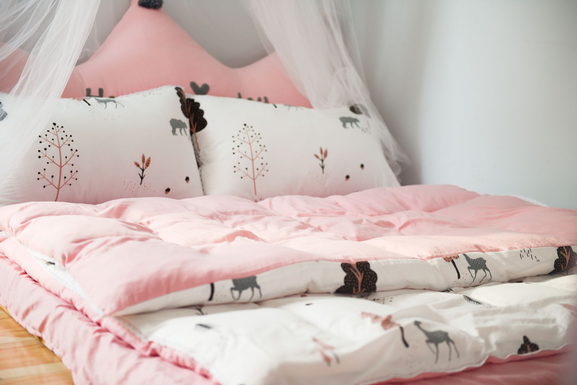 Plush comforter arranged across a bed